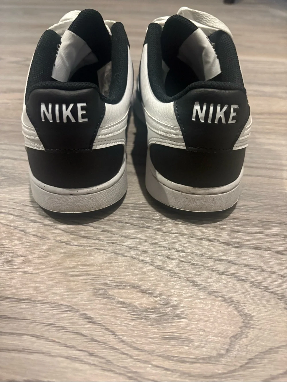 Nike Women’s Black and White Low-Top Sneakers with White Swoosh